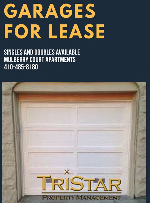 a white garage door with a sign that reads garage for lease