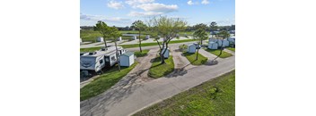 A sunny day at the RV park with a clear blue sky.