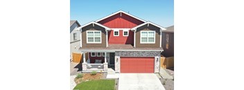 a red and brown house with a red garage door