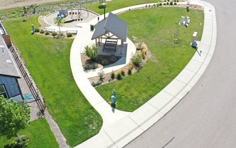 an aerial view of a park with a gazebo in the middle