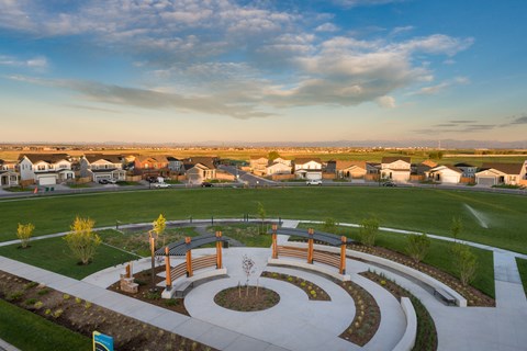 an aerial view of a park with a fountain