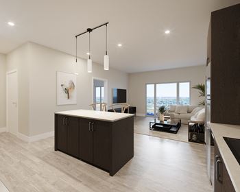 A modern kitchen with a large island and a dining area.