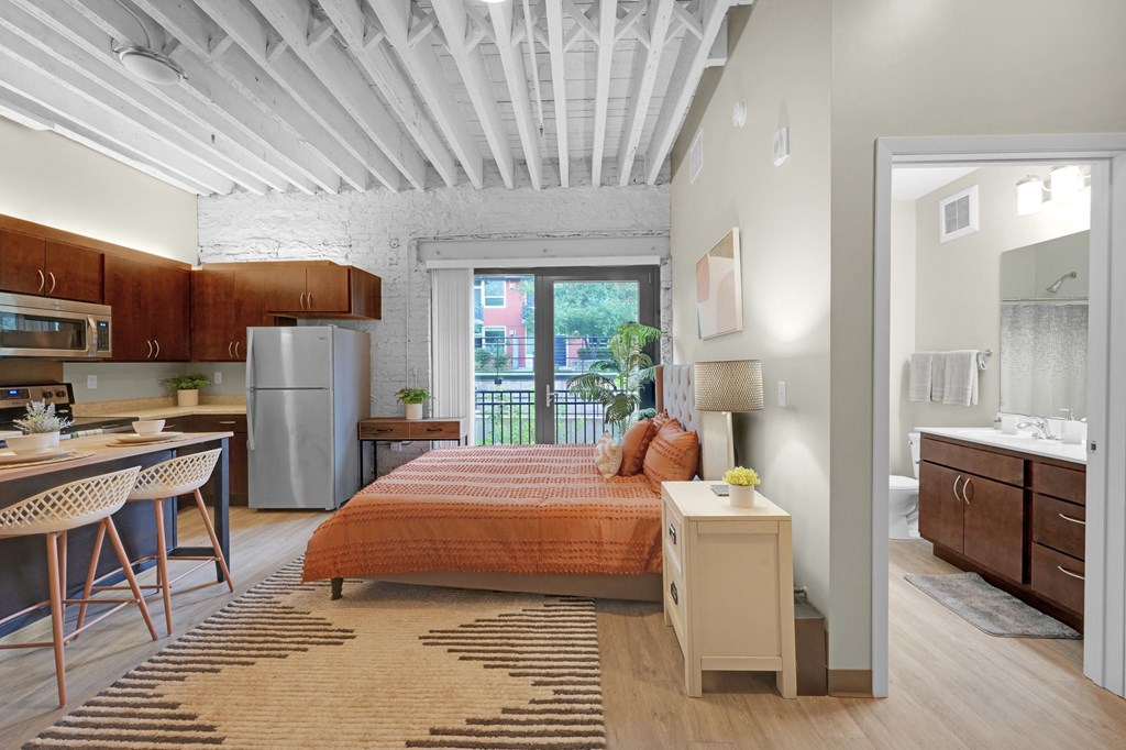 a bedroom with a bed in a room