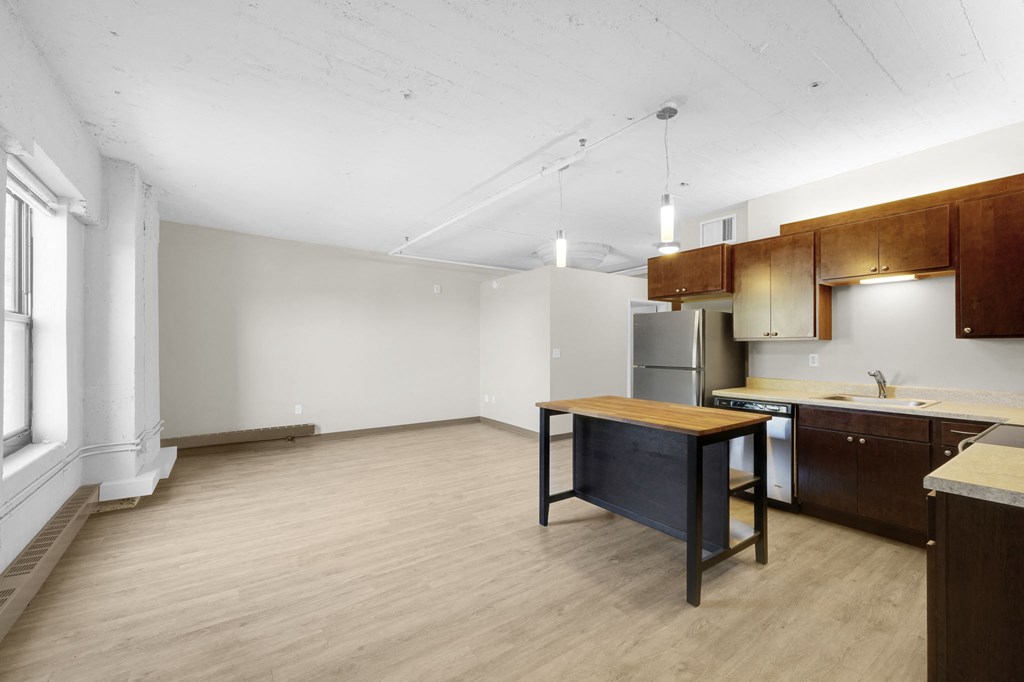 a kitchen and dining area in a 555 waverly unit