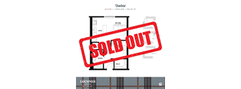 a red sold out sign in front of a house sold out