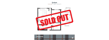 a red sold out sign in front of a sold out house