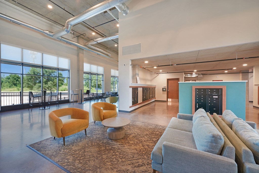 a living room with couches and chairs under a colorful ceiling