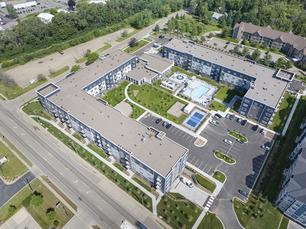 an aerial view of an office building and a parking lot