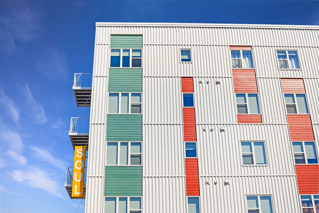 a tall building with a sign on the side of it