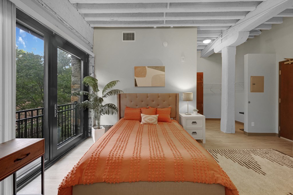 a bedroom with a bed in a room