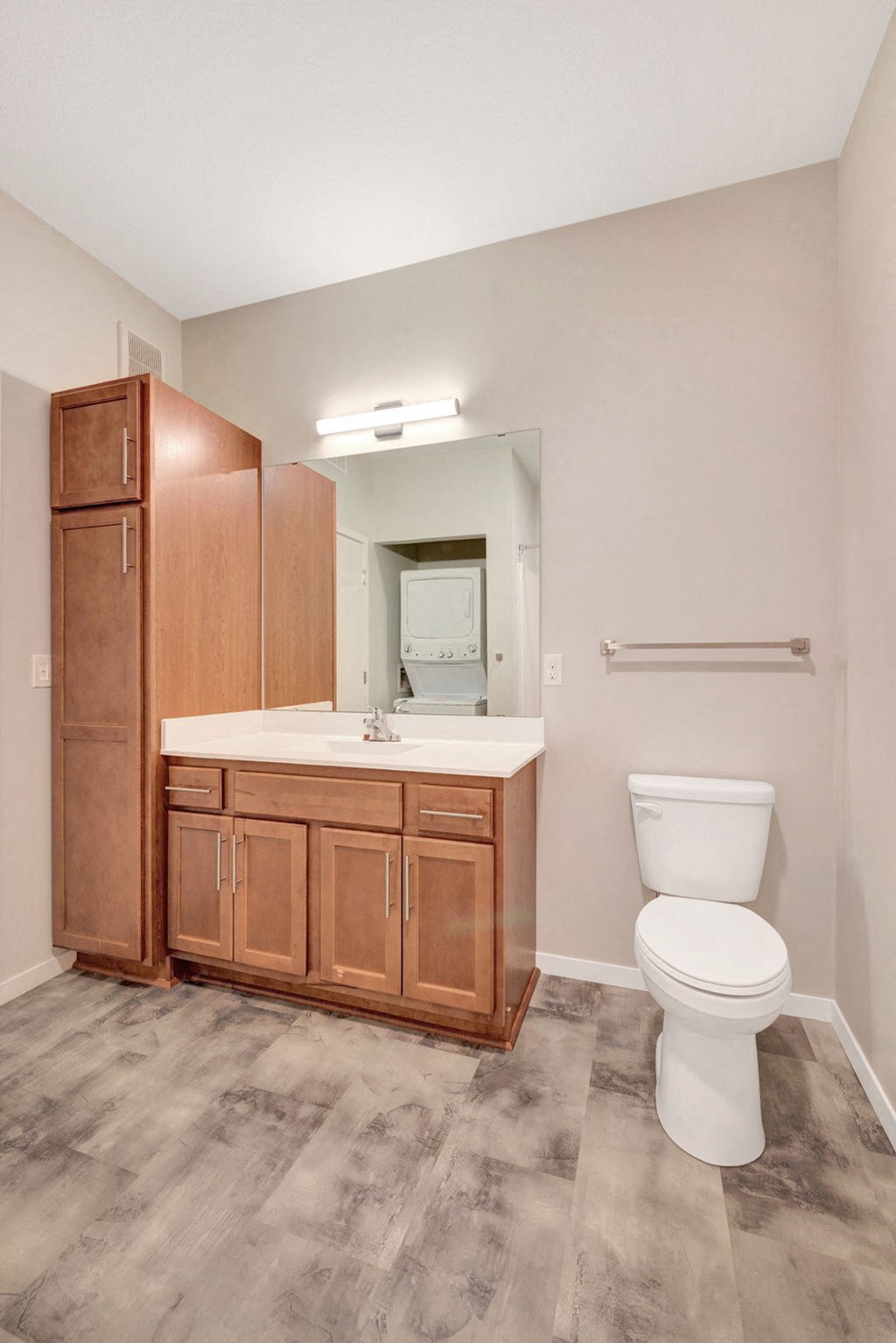 a bathroom with a toilet and a sink and a mirror