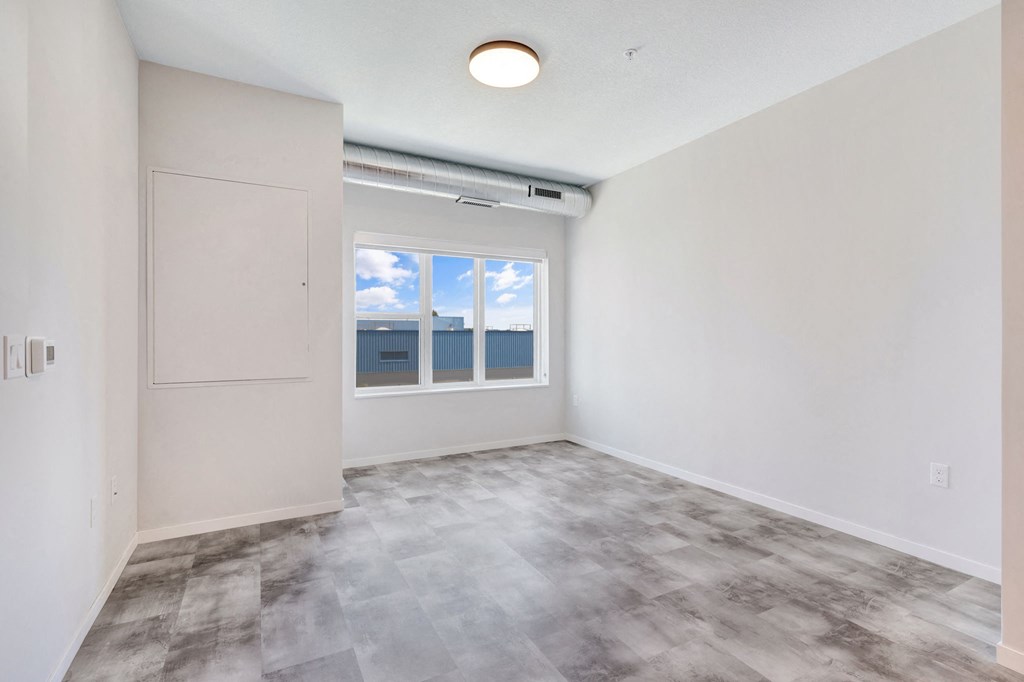 a room with purple and blue walls and a window