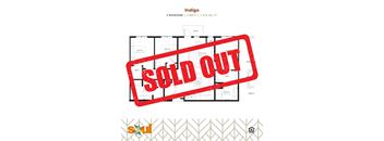 a red sold out sign in front of a sold out plot