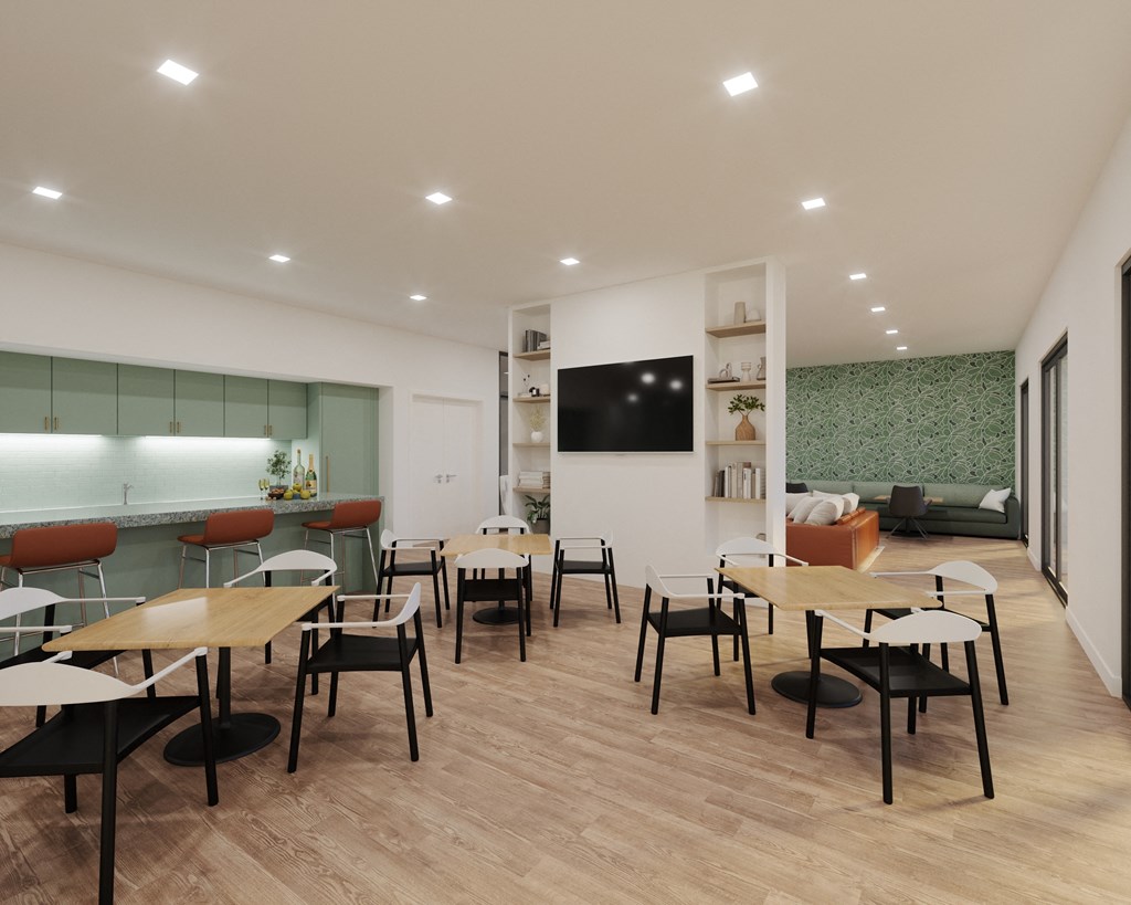 A modern dining room with wooden floors and white walls.