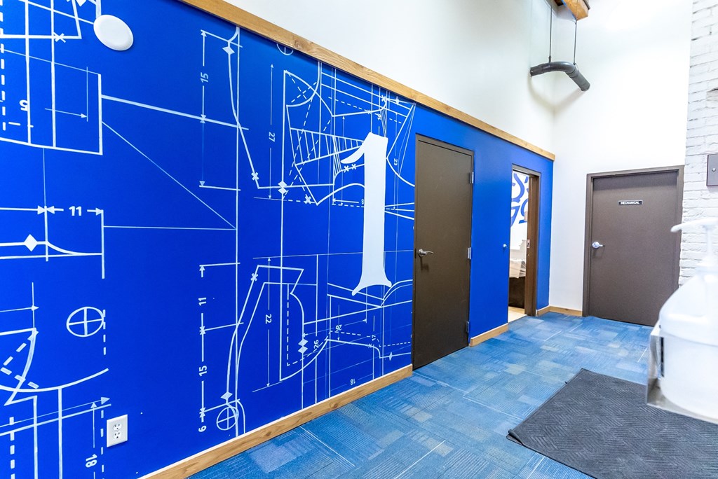 a blue wall with a design on it