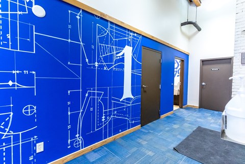 a blue wall with a design on it