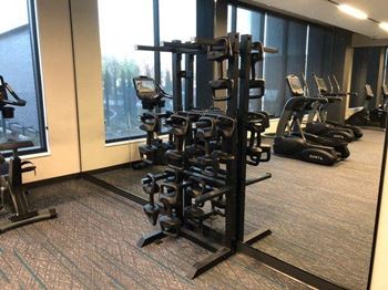 a room filled with lots of exercise equipment