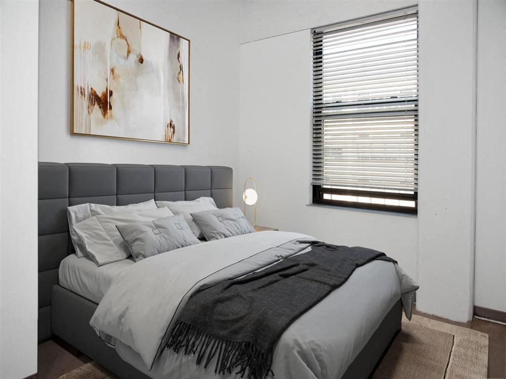 bedroom with window and bed