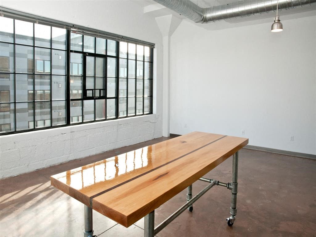 Wood island and huge warehouse window