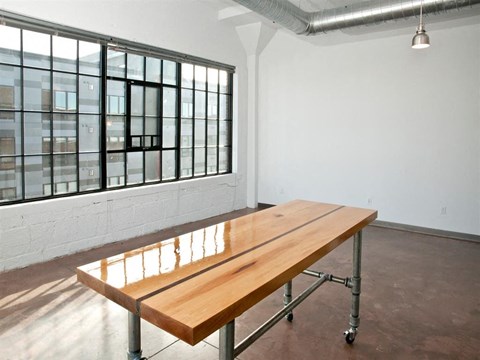 Wood island and huge warehouse window