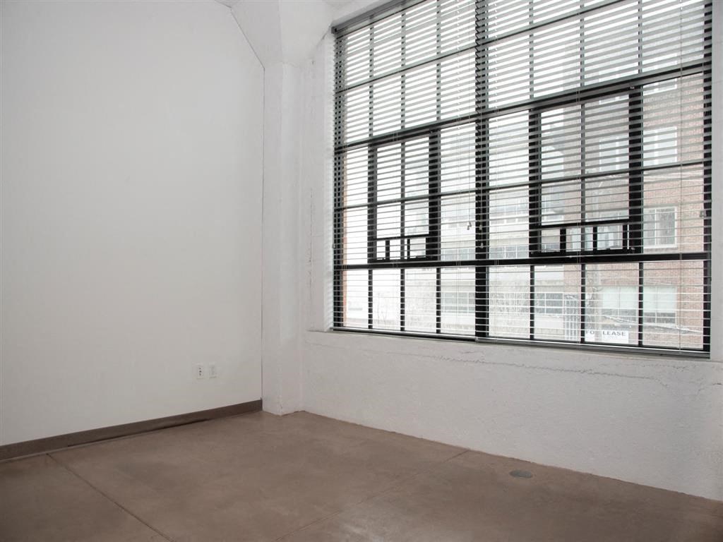 living room with large windows and tall ceilings