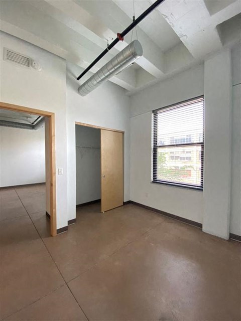 bedroom with closet and window