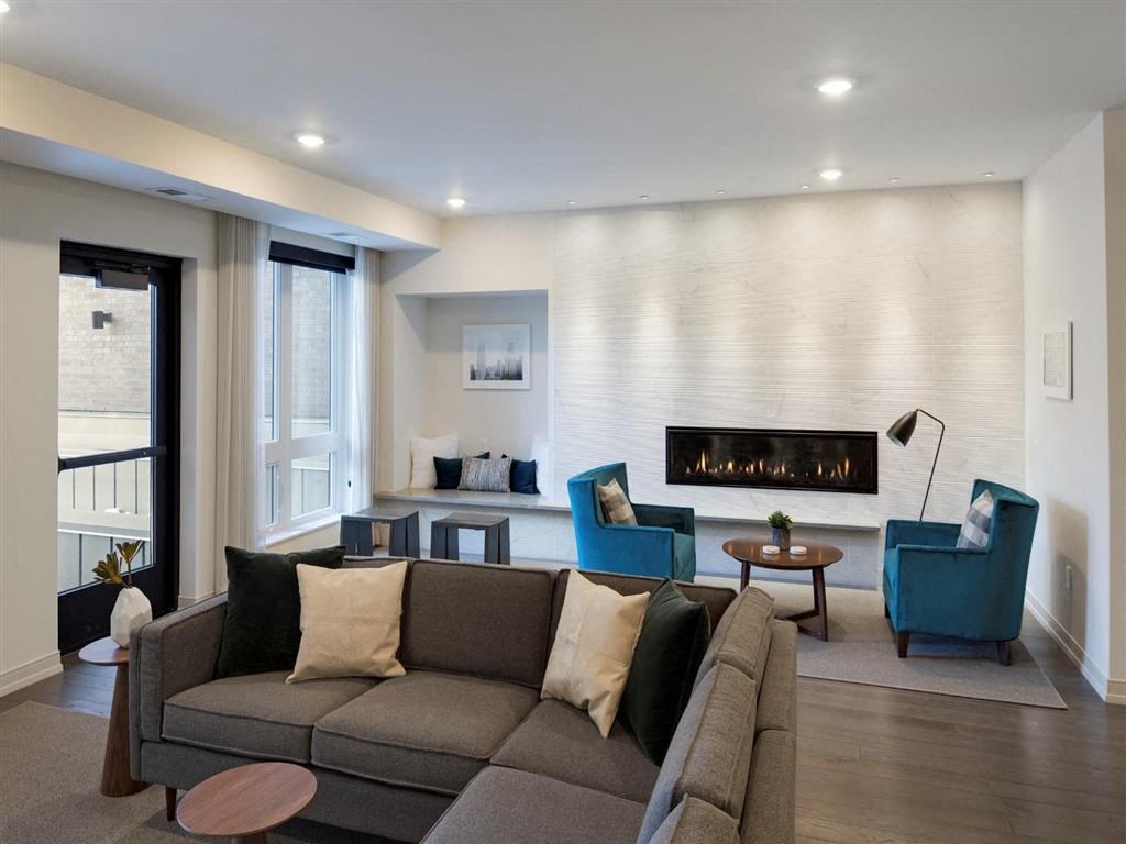 clubroom with couch and fireplace