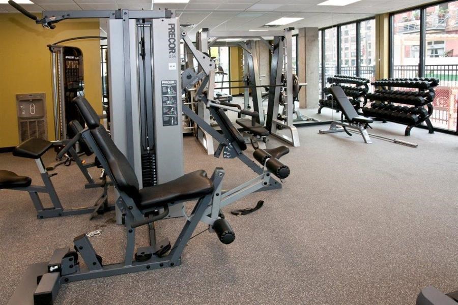 Fully equipped fitness center with leg press and bench press