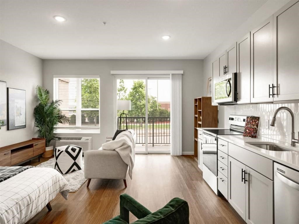 a kitchen with a stove top oven next to a window