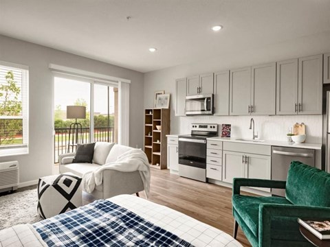 a living room with a kitchen and a couch