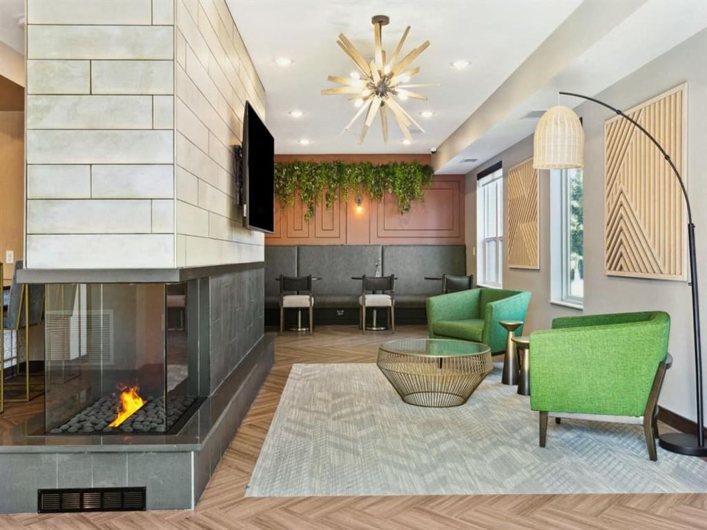 a living room filled with furniture and a fire place