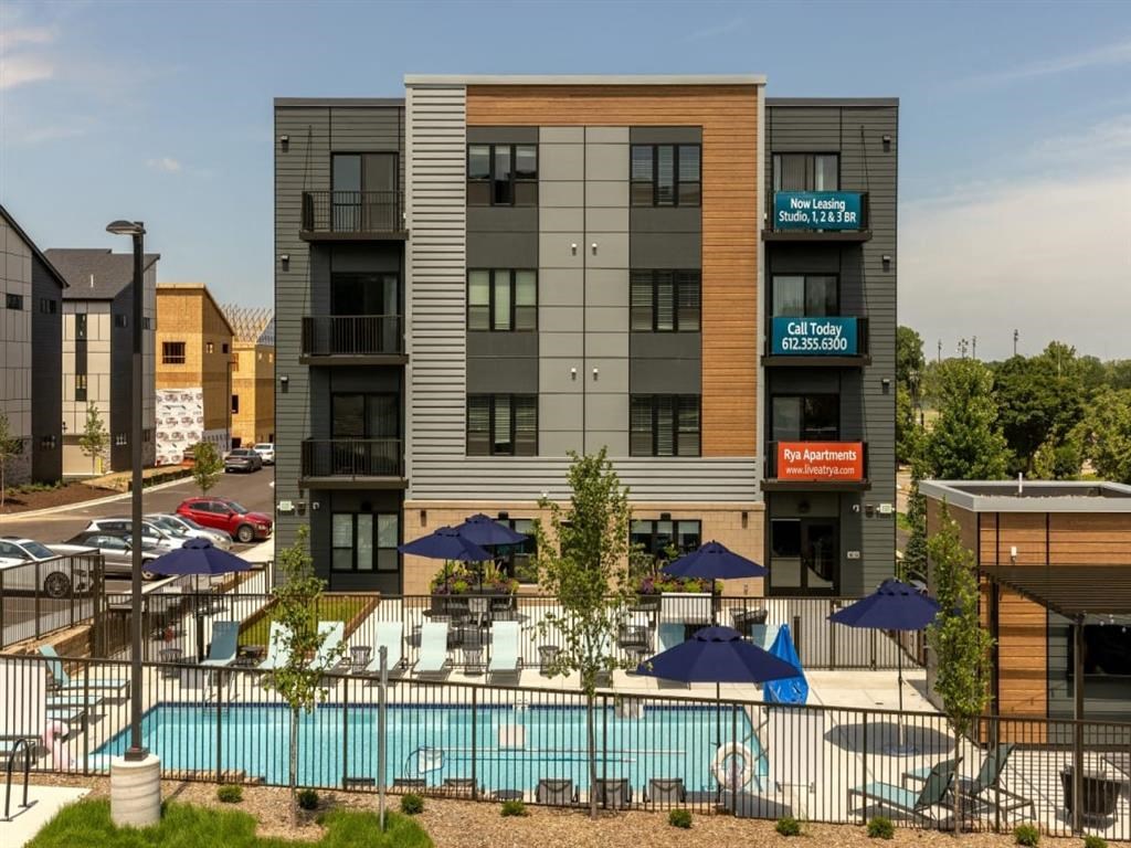 a large building with a pool in front of it