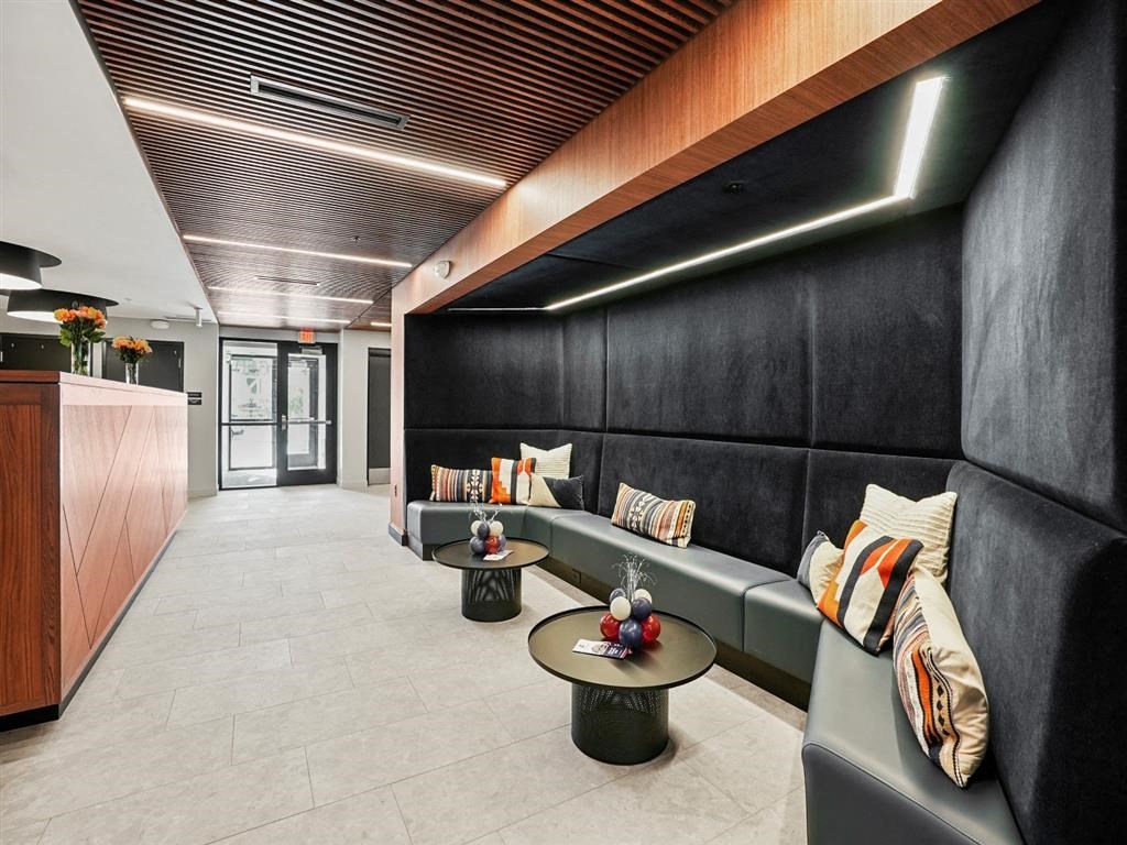 a lobby with couches and tables