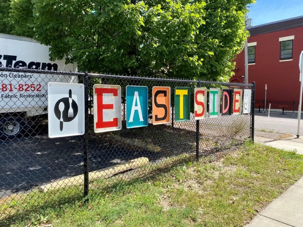 a fence with a sign on it that says eastside
