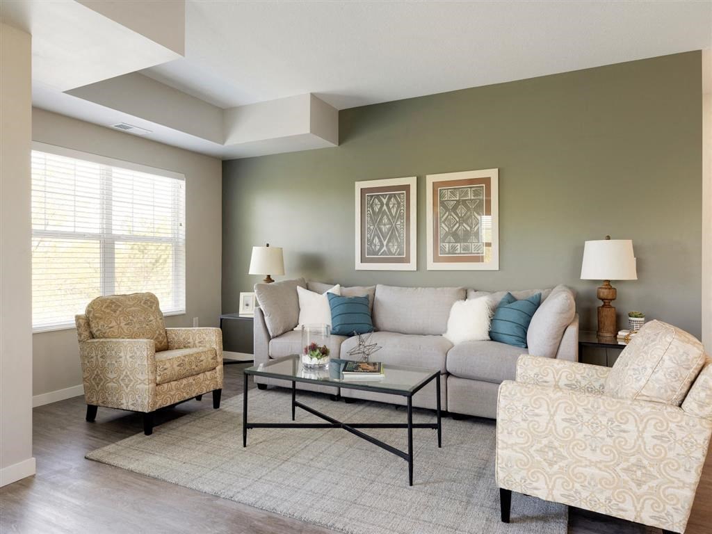 living room with green accent wall