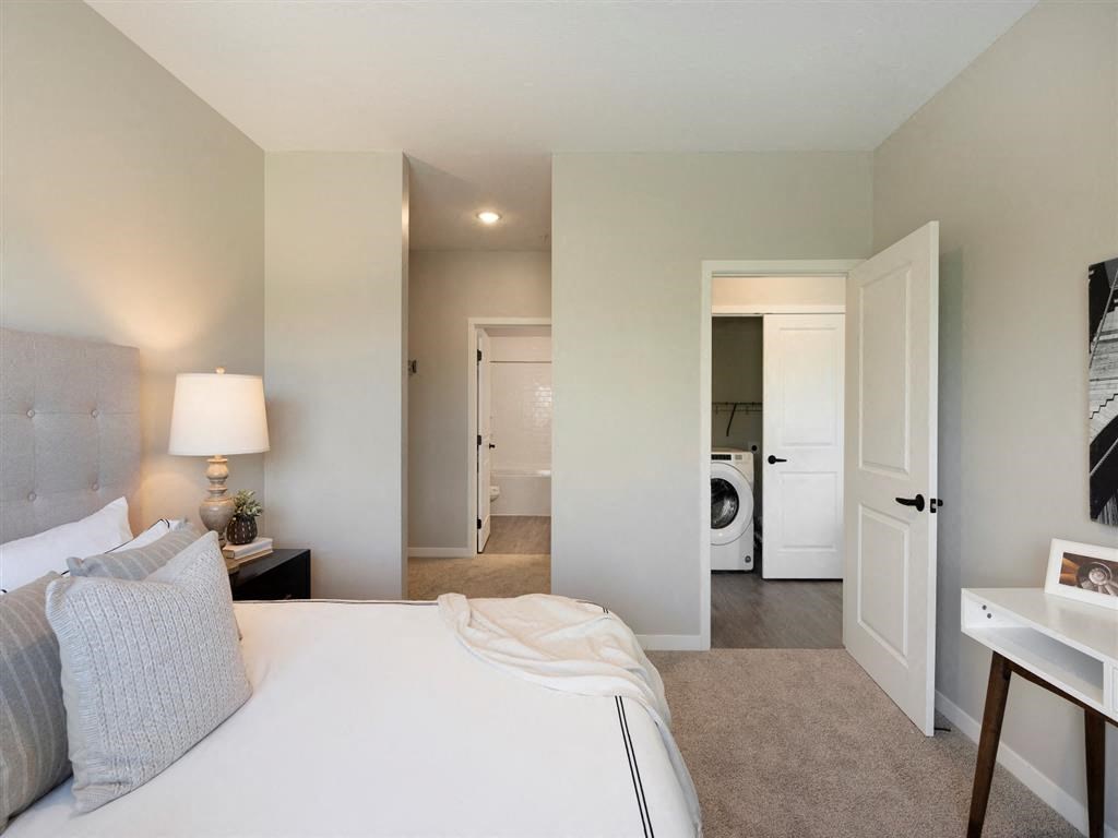 bedroom with attached bathroom and closet