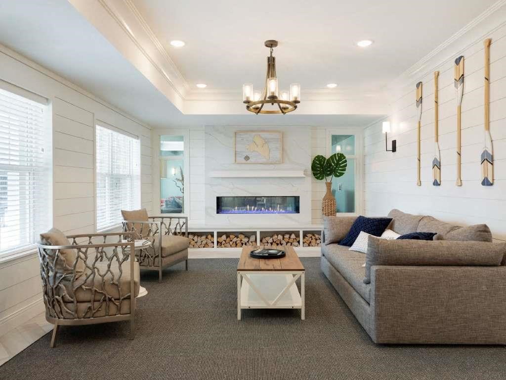 Bright and airy lobby living room with couch and chairs