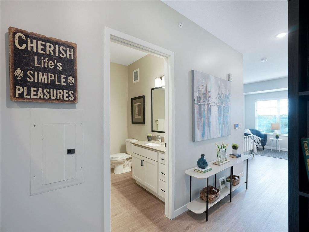 entryway of apartment with view into bathroom