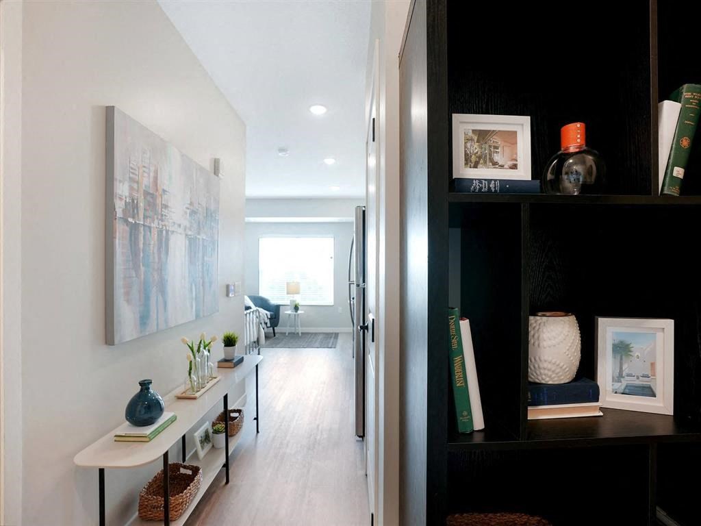 entryway for studio apartment with bookshelves