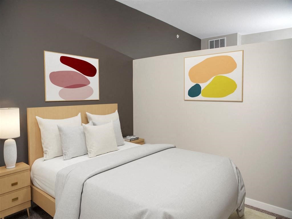 bedroom with partial wall