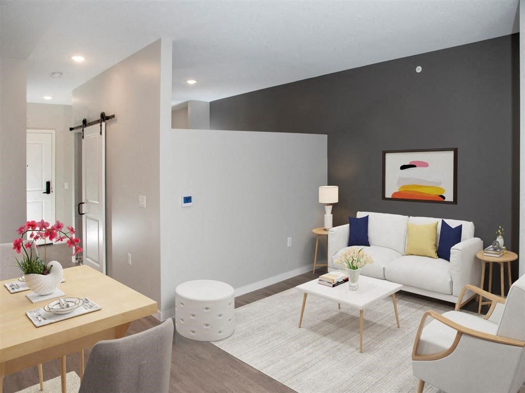 bedroom with partial wall and barn door
