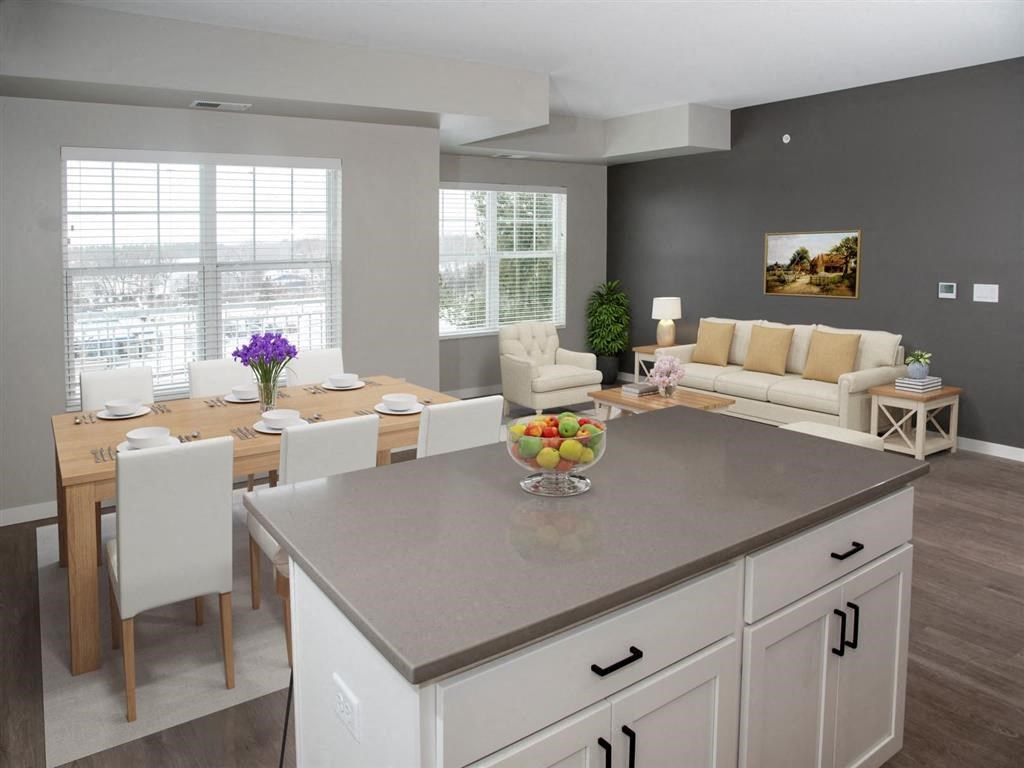 kitchen island and view of living room and dining room