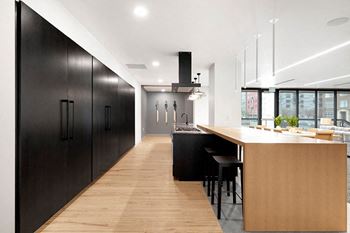 Club Room with Chef's Kitchen and a Two-Sided Fireplace