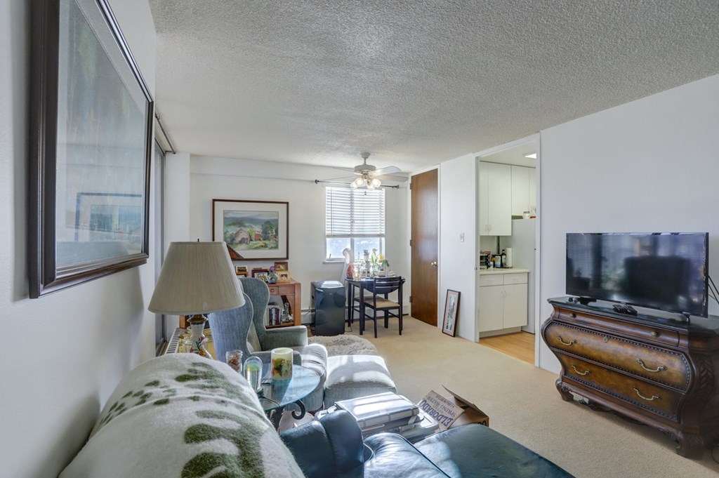 the living room is open to the dining room and kitchen