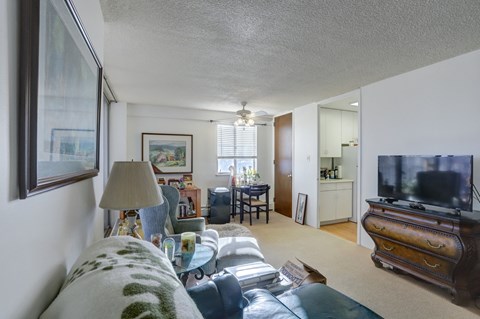 the living room is open to the dining room and kitchen