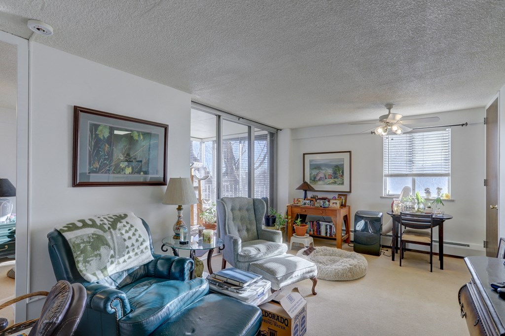 the living room and dining room of an apartment