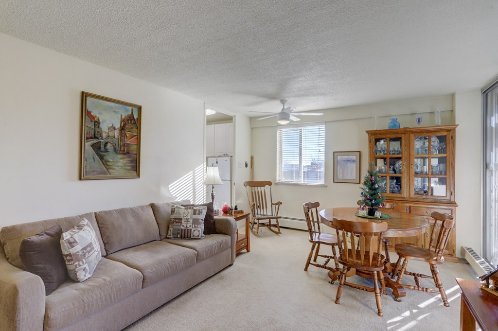 a living room and dining room with a couch and a table