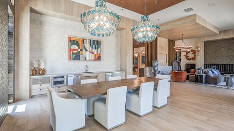 resident lounge with wet bar and large table with seating