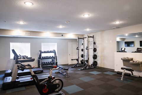 Fitness center with cardio and weight training equipment at Rivers Edge Apartments, Otsego