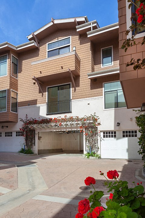 A house with a white garage door and a driveway.